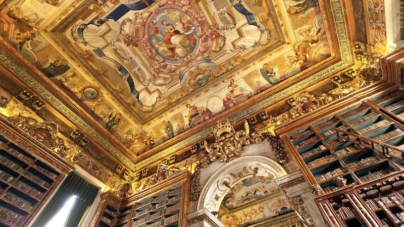 European universities: The painted ceiling of King João’s Library at Portugal’s University of Coimbra is an example of the Baroque illusion technique called trompe l’oeil. CREDIT: Dominic Arizonia Bonuccelli, Rick Steves’ Europe.