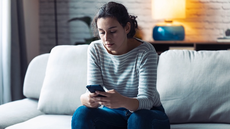 A woman on her phone, always the planner for getting together with friends. Nenitorx
