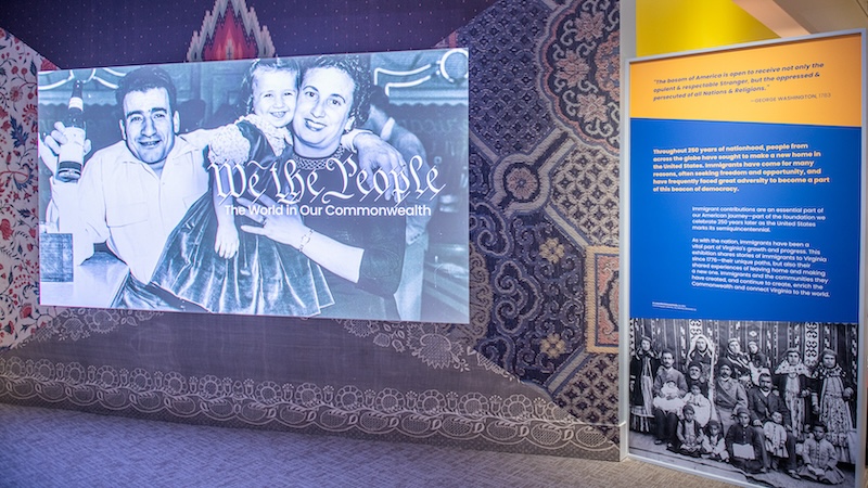 VMHC_We The People_Title Screen with Couple on Video Display_Courtesy of VMHC