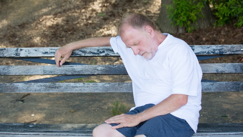Take a nap! Man taking a power nap on a park bench. Nanditha Rao