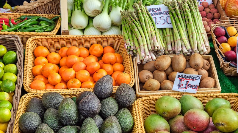 Market produce baskets including some of the five spring foods to enjoy this season.