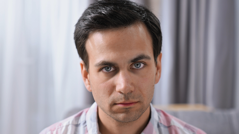 A rude, disrespectful fiancé glares at his future in-laws. By Anatoly Epaneshnikov