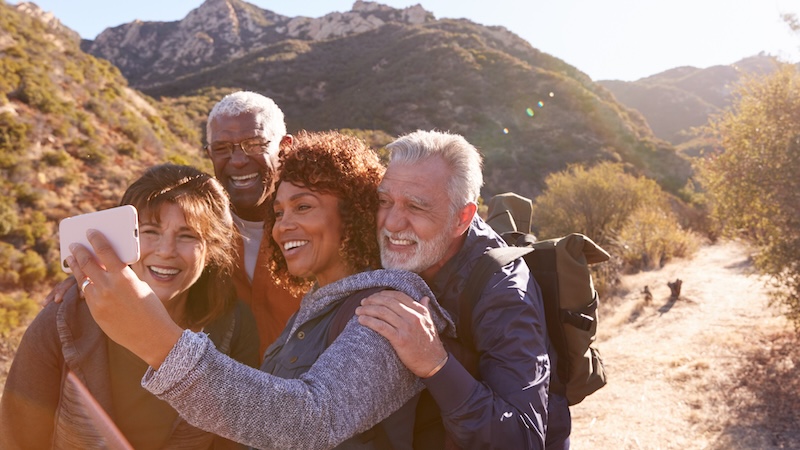 After planning for an active retirement, these four older adults have the energy and resources to enjoy travel and hiking. Monkey Business Images