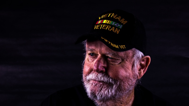 A Vietnam veteran seeks his lost love, with a pensive look on his face. Thomas Bullock