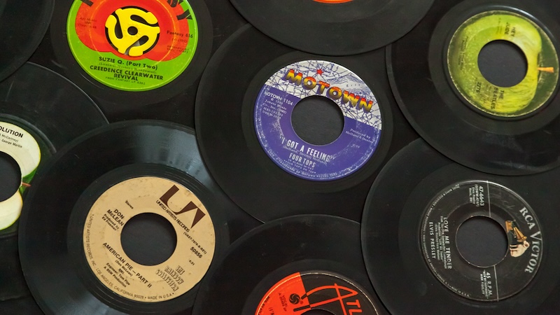 45 RPM vinyl records by Erin Cadigan, with the A-side up showing the artists' names.