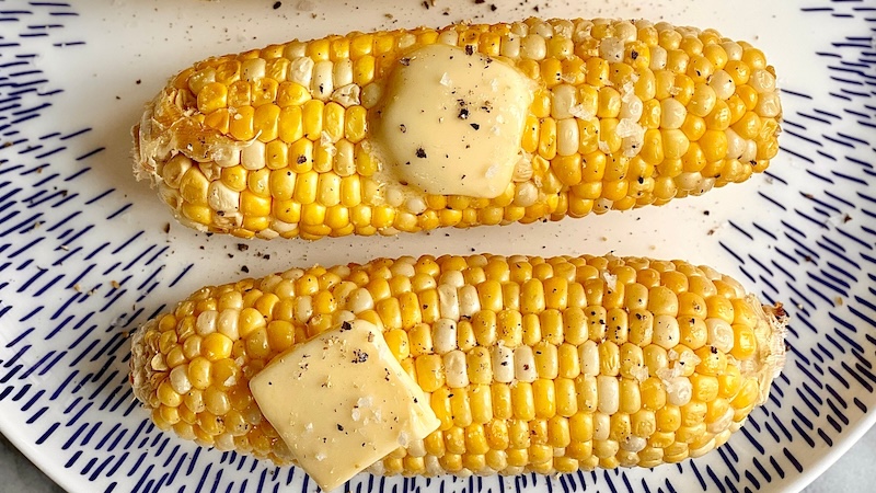 air fryer corn on the cob with butter, salt, and pepper