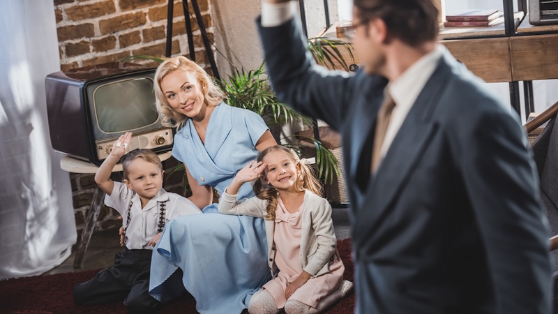 A child's memories of the 1950s might include the so-called traditional family like this one: a stay-at-home mom with two kids as the dad leaves for work. Lightfieldstudiosprod