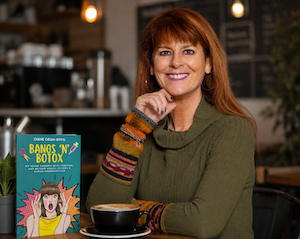 Diane Dean-Epps, writer of this essay on a 1970s beauty pageant, with her book, Bangs and Botox