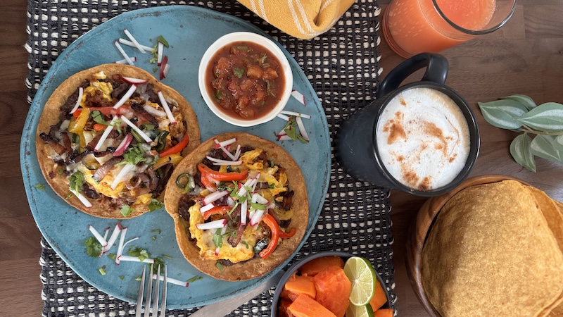 With bacon, chorizo and three peppers, breakfast tostadas make a hearty start to a fun-filled day, on vacation or any time of year.