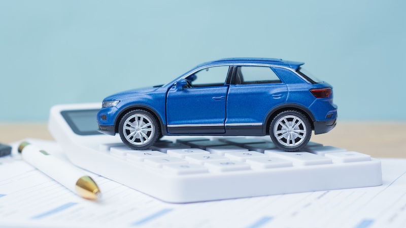 Small model car on a calculator and paperwork. Is there a downside to switching insurance often? There are some considerations to keep in mind before switching insurances. (Dreamstime/TCA)