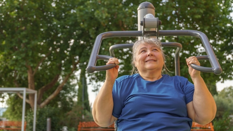 maintaining muscle while losing fat using an outdoor weight-training machine. Wirestock