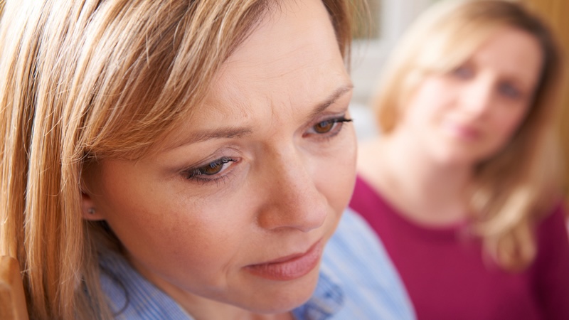 Sad woman needs to talk about her negative feelings about the friend of a friend