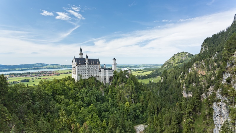 King Ludwig II’s fantastical Neuschwanstein Castle is the epitome of 19th-century Romanticism. CREDIT: Rick Steves. Royalty and the ultra-wealthy have second homes fancier and more opulent than other people’s primary homes. European palaces exemplify this extravagance, like Mad King Ludwig II’s Neuschwanstein Castle, Versailles, and more.