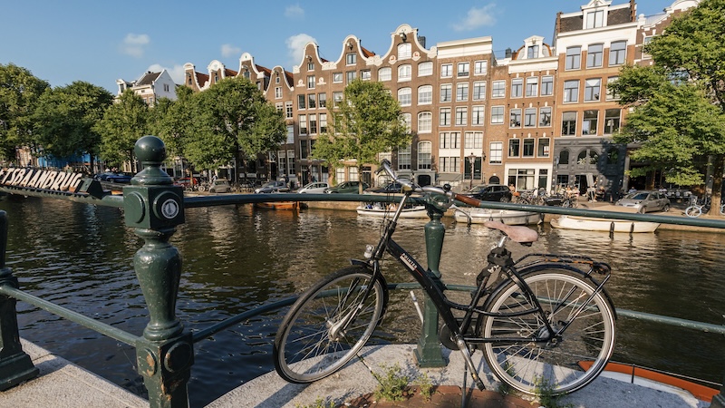 Traveling through Amsterdam by bike is one of the best ways to appreciate the city’s sights, smells, and overall vibe. CREDIT: Dominic Arizona Bonuccelli, Rick Steves’ Europe.