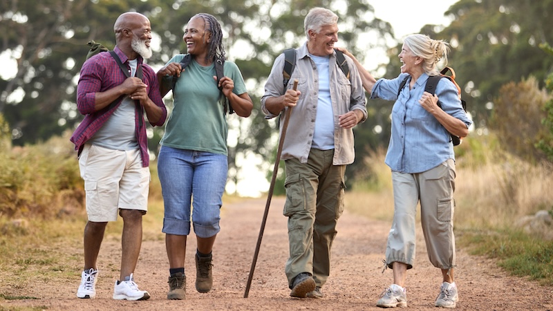 Active aging friends on a hike. Monkey Business Images