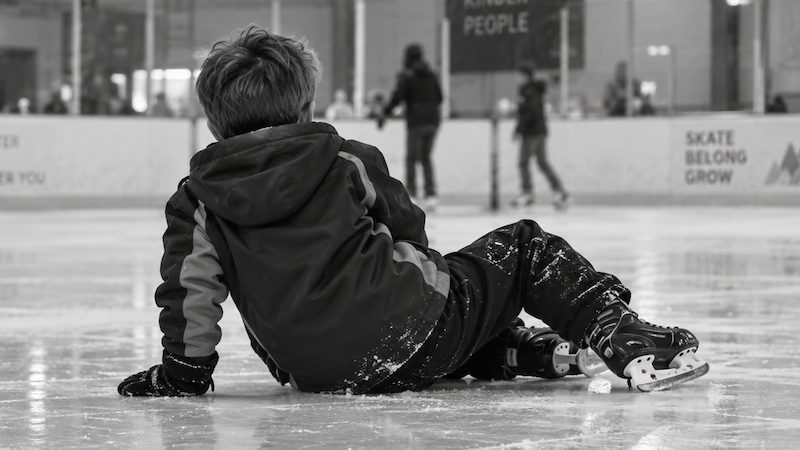 boy fallen on the ice while skating, not skating through life. ChatGPT image