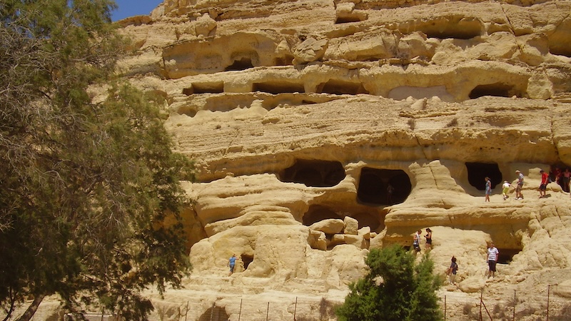 Climbing on the caves where the flower children of Matala stayed