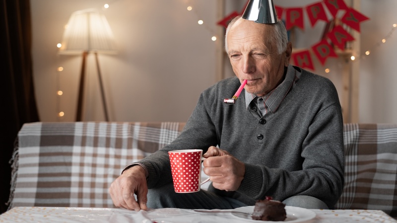 Senior man alone on his birthday, with the birthday blues. Andrii Lysenko