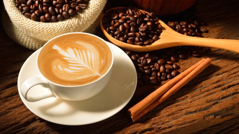 Coffee beans and a latte, representing Great American coffee shops