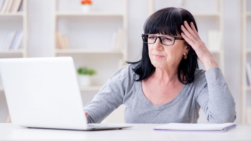 Woman at her laptop, not happy, bemoaning that "everyone is making money from my books but me." Credit: Elnur